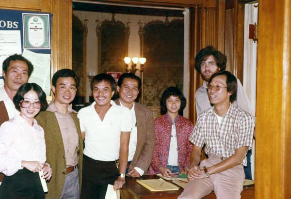 8 people standing for group photo