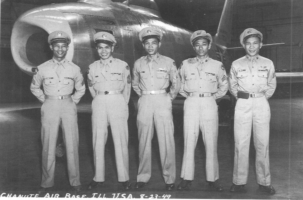 Philippines veterans standing in front of aircraft.
